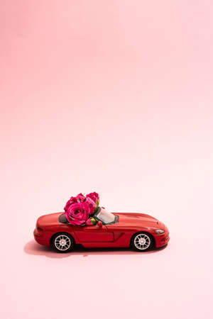 Gift for March 8 stands on a pink backgroundの写真素材