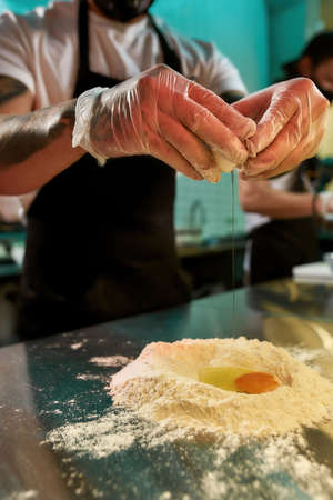 Man preparing fresh bread in the kitchen