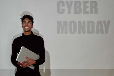Young african american man near Cyber Monday signの写真素材