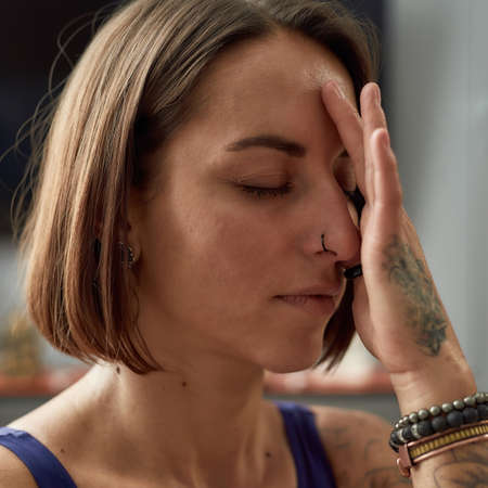 Meditation session of a girl with tattoos
