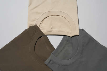 Sweaters of different colors on an white