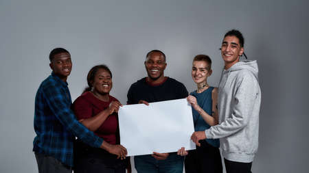 Happy multiracial people holding banner mockupの写真素材