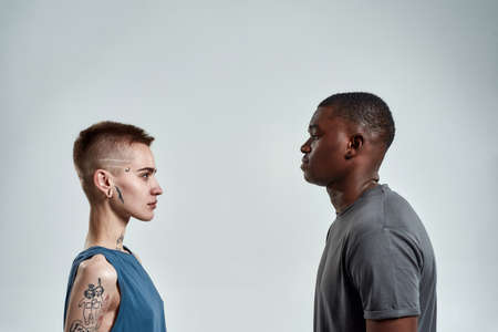 Young man and woman looking at each otherの写真素材