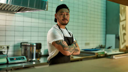 Man working as a chef in the kitchenの写真素材