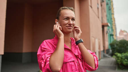 Young girl in headphones before morning jog