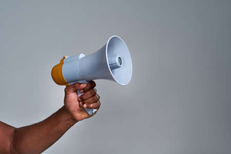 Megaphone held by african american personの写真素材