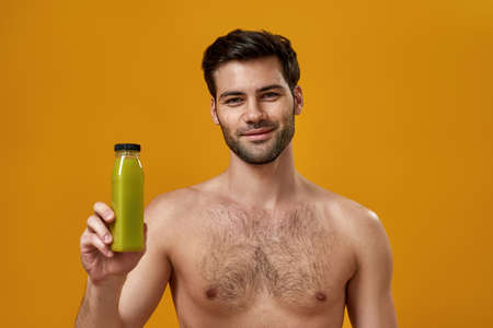 Young bearded man with naked torsoの写真素材