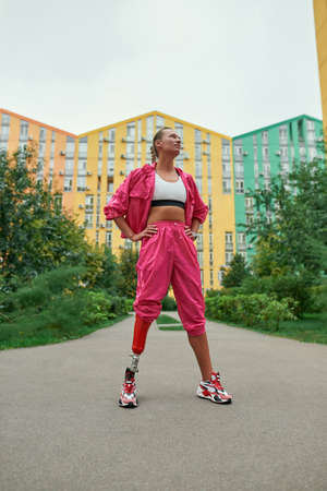 Disabled sports woman with leg prosthesis
