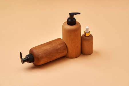 Set of wooden containers of different sizes isolated on beige background. Zero waste and eco conscious lifeの写真素材