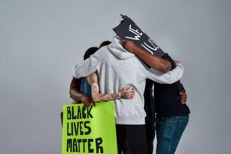 Young multiracial people embracing each other
