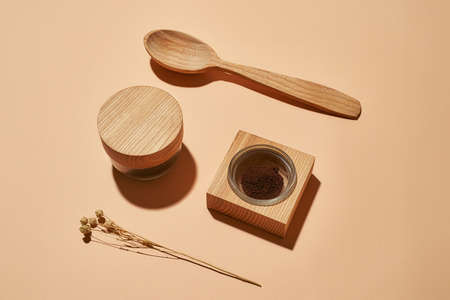 Organic cosmetological scrub next to wooden spoonの写真素材