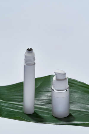 Skin care roller and bottle with dispenser