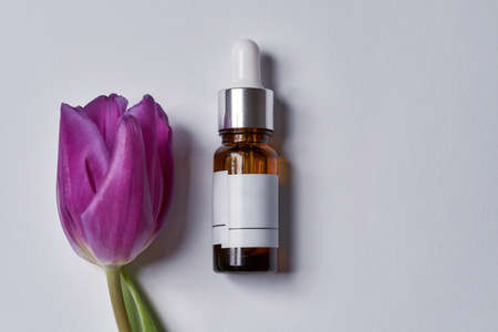 Glass bottle with pipette and blank label lyingの写真素材