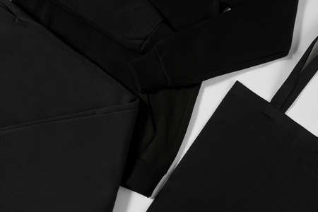 Black hoodie, pants and eco bag isolated on white background
