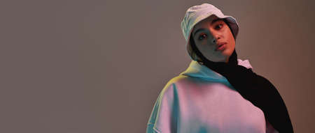 Modern young arabic girl in hijab and panama