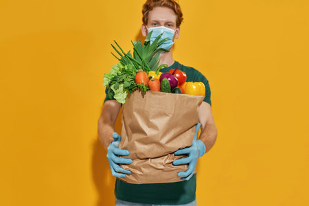 Selective focus on packet with fresh vegetablesの写真素材