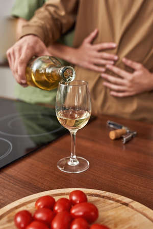 Selective focus on man pouring wine into glassの写真素材