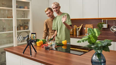 Homosexual caucasian male couple shooting vlogの写真素材