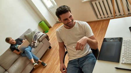 Young couple takes part in corporate video callの写真素材