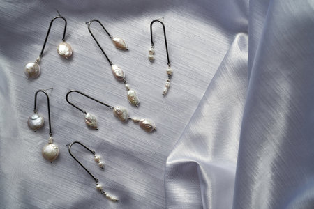Stylish sterling silver dangle earrings with pearls