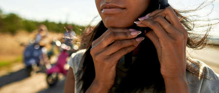 Close up view of girl putting on safety helmet