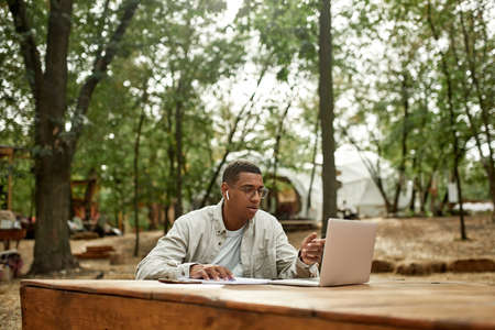 Young african american man talking via online conferenceの写真素材