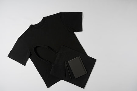 T-shirt bag and wallet lying on the floor