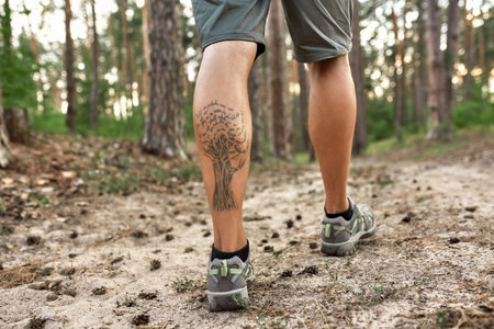 Muscular legs of caucasian man trekking along pathの写真素材