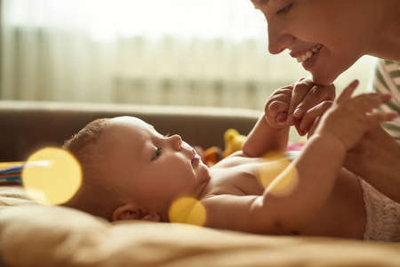 Close relationship between caring mother and childの写真素材