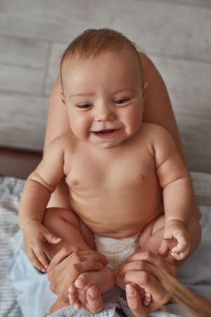 Portrait of adorable smiling baby, top viewの写真素材