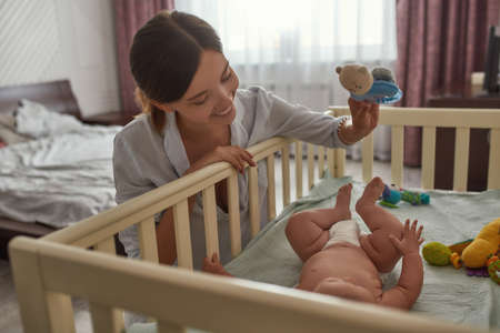 Portrait of young mother playing with her childの写真素材