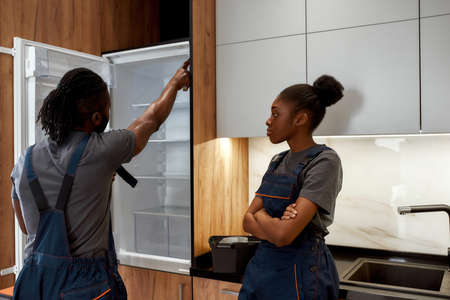 Young female apprentice displeased because of unfulfilled hopes or expectationsの写真素材