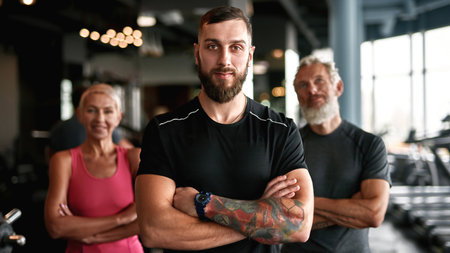 Young professional trainer with senior man and womanの写真素材