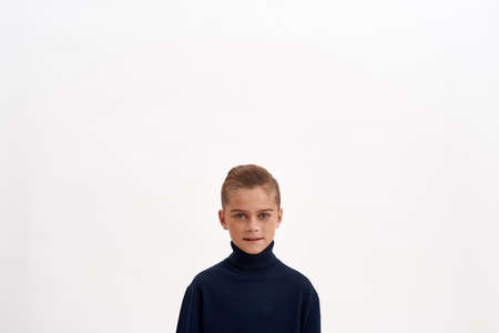 Portrait of happy little oy child on white backgroundの写真素材