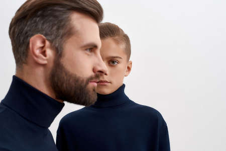 Portrait of two male generations in studioの写真素材