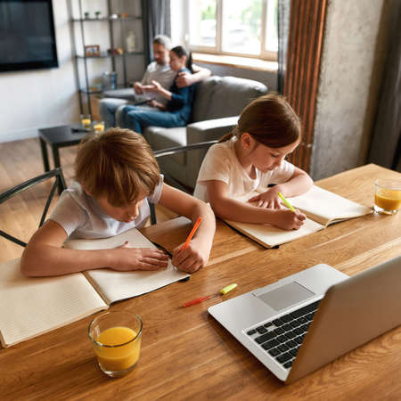 Smart small kids study alone online on computerの写真素材