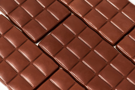 Close up shot of many sweet delicious chocolate bars pattern isolated