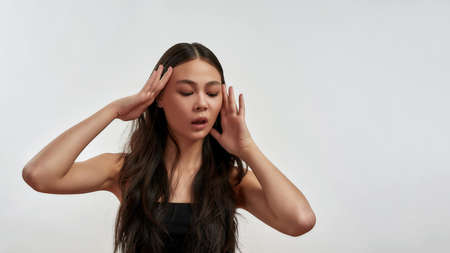 Young Asian woman look down at offer dealの写真素材
