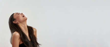 Web banner of smiling Asian woman laugh on white backgroundの写真素材