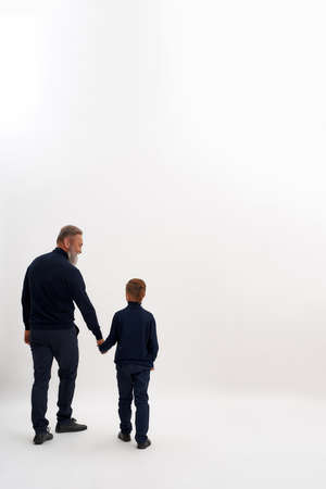 Back view of grandfather lead small grandsonの写真素材