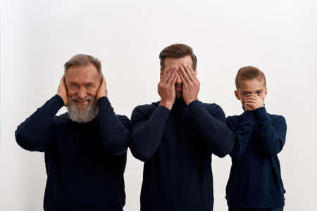 Portrait of smiling three generations of men have fun