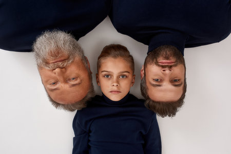 Portrait of three male generations facesの写真素材