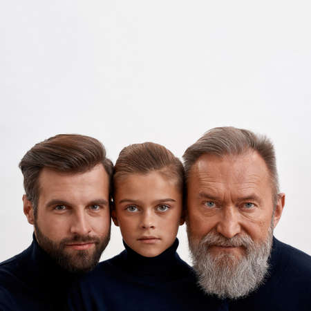 Faces of three generations of Caucasian menの写真素材