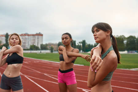 Women stretching before run training on treadmillの写真素材