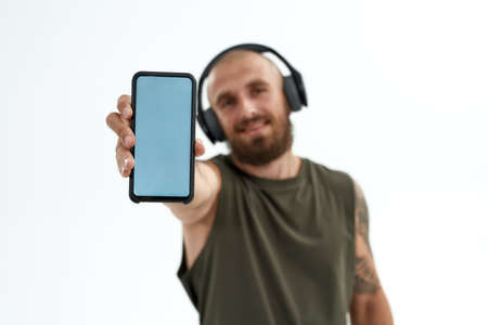 Selective focus of smartphone in hand of manの写真素材