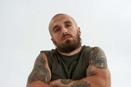 Young confident caucasian man with crossed arms