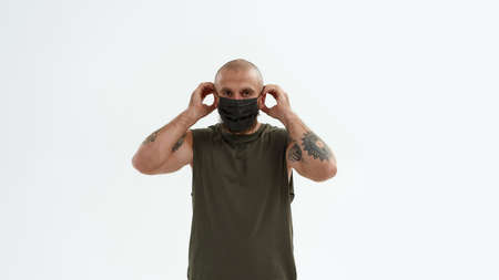 Young caucasian man wear medical mask on his face