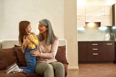 Loving grandmother taking care emotionally of her grandchild