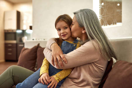 Delayed parenthood concept. Elder mother with daughterの写真素材