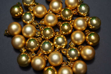 Close up of collection of golden christmas ballsの写真素材